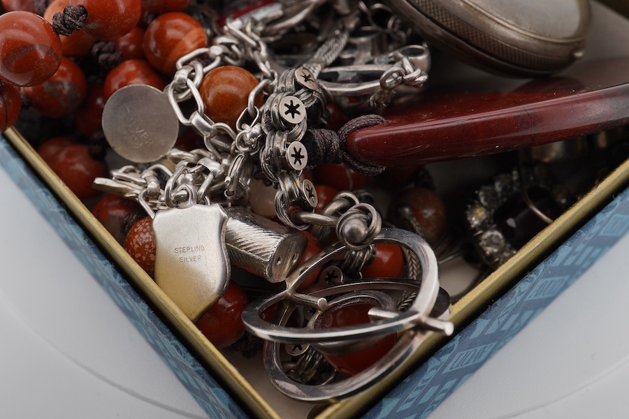 A mixed group of silver jewellery, including two charm bracelets, an Art Nouveau-style pendant; a pocket watch on chain; a pair of moonstone earrings; an onyx and marcasite pendant; a cross pendant; a carnelian pendant;